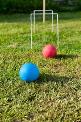 game of croquet on green lawn