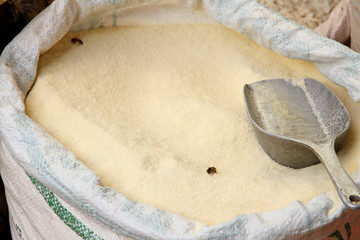Sack of Cane Sugar with Scoop and Bees