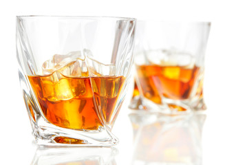 Two glasses of scotch whiskey, isolated on white