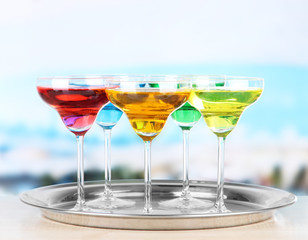 Different cocktails on bright background