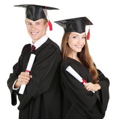 Two happy graduating students isolated on white