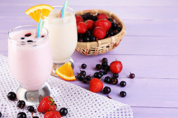 Delicious milk shakes with orange and blackberry