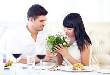 Beautiful couple having  romantic dinner at restaurant