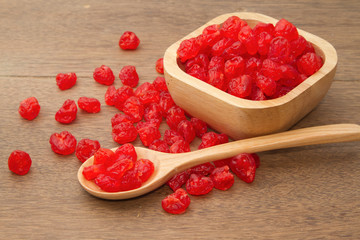 dried cherry in the wooden spoon
