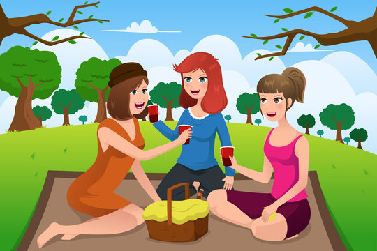 Young women having picnic in a park