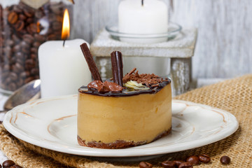Cappuccino cake on white plate. Selective focus