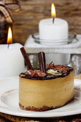 Cappuccino cake on white plate. Selective focus