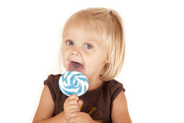 Blue eyed toddler with a blue swirl sucker