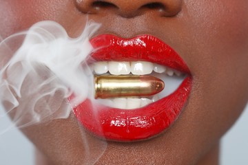 Lips of a Woman With A Bullet and Smoke
