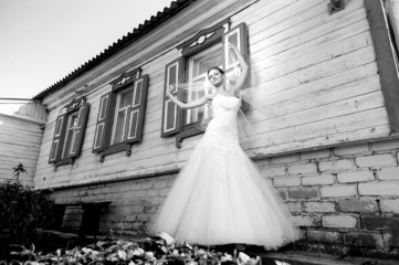 bride near a village house