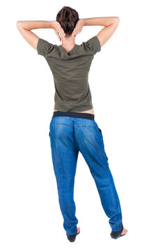 back view of standing young beautiful  woman.  brunette girl ibe