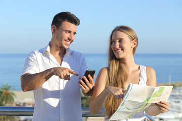 Couple discussing map or smartphone gps on vacations