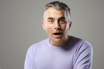 Fototapeta premium Portrait of casual man surprised