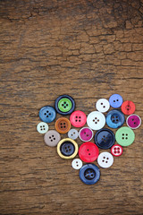 Heart of old colorful buttons