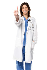 Smiling doctor giving a thumbs up gesture