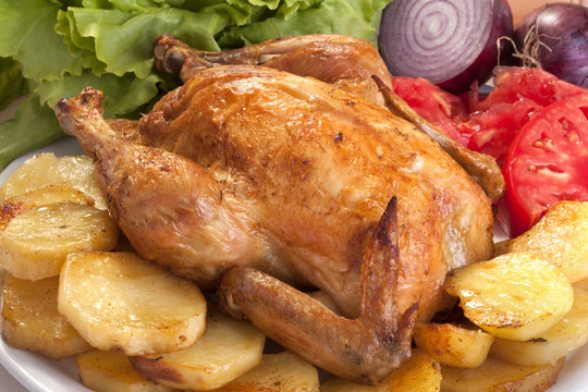 roast chicken with potatoes, vegetables and salad