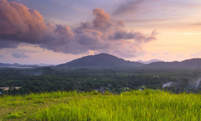 Grass Mountain and blue sky background located in Ranong, Thaila