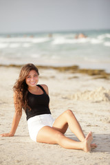 Fototapeta na wymiar Stok image of a woman sitting by the shore