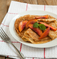 Crepes with fresh peaches