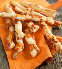 Puff pastry sticks with melted cheese