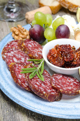 snacks - sausage, sun-dried tomatoes, nuts, fruit, cheese