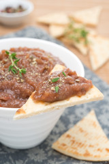 vegetable pate of eggplant and tomatoes on a piece of pita bread
