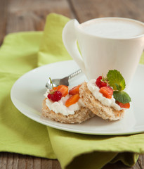 Toast with cream cheese and fruits for breakfast