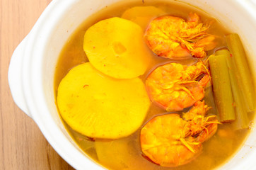 Sour and spicy shrimps curry with bamboo shoot and lotus stem