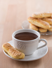 Chocolate cup with whipped cream and ladyfingers