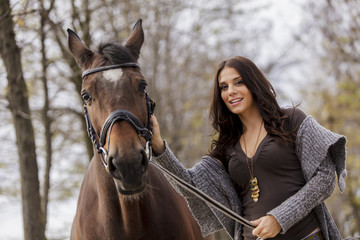 Obraz premium Young woman with a horse
