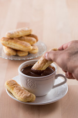 Chocolate cup with whipped cream and ladyfingers
