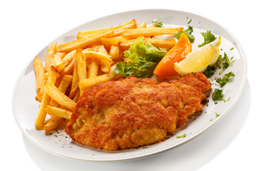 Pork chop, French fries and vegetables