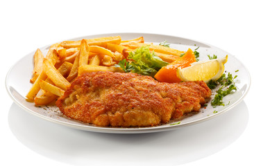 Pork chop, French fries and vegetables