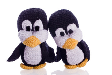 couple of black and white penguin stuffed animal