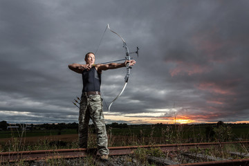 Man with bow and arrows - 55533243