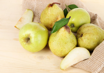 Pears on burlap on wooden table