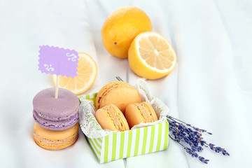 Macaroons on white cloth close-up