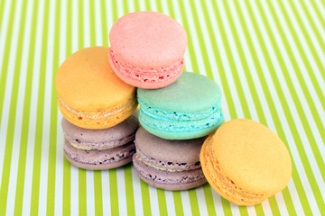 Gentle macaroons on green background