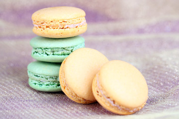 Macaroons on fabric background