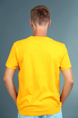 T-shirt on young man, on grey background