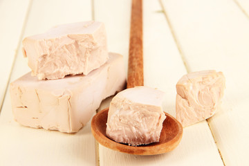 Dry yeast on wooden table close-up