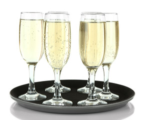Many glasses of champagne on the tray, isolated on white