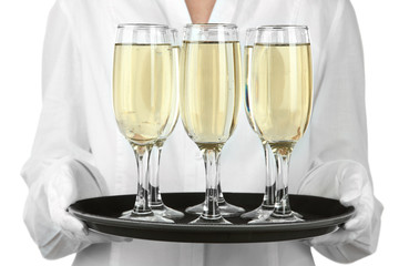 Waitresses holding tray with glasses of champagne, isolated