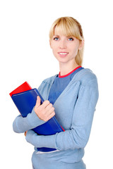 Portrait of a cheerful student. Female holding documents. The girl looks into the camera