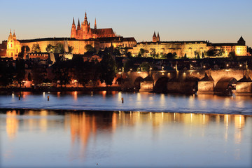 Prague gothic Castle with Charles Bridge after sunset
