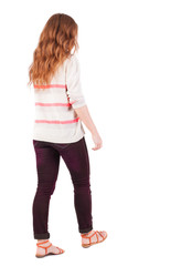 back view of walking  woman