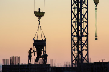 Pouring concrete into a newly built house