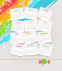 Cardboards with calendar of 2014 on a colorful background