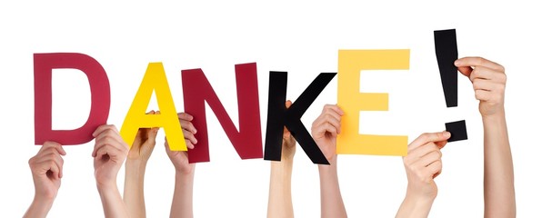 Hands Holding Danke in German Colors