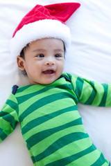 Asian boy baby in Christmas suit 